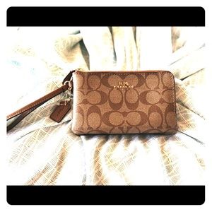 Like new authentic Coach wristlet .